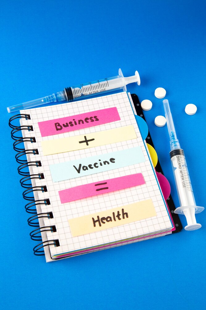 front view business vaccine health note with vaccine and injection on blue background